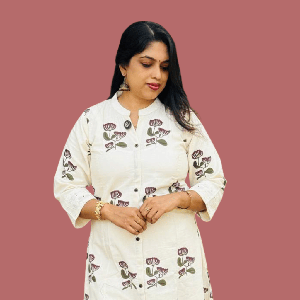 Woman in embroidered peach outfit